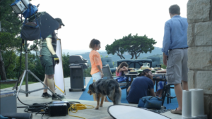 outdoor video shoot crew and dog