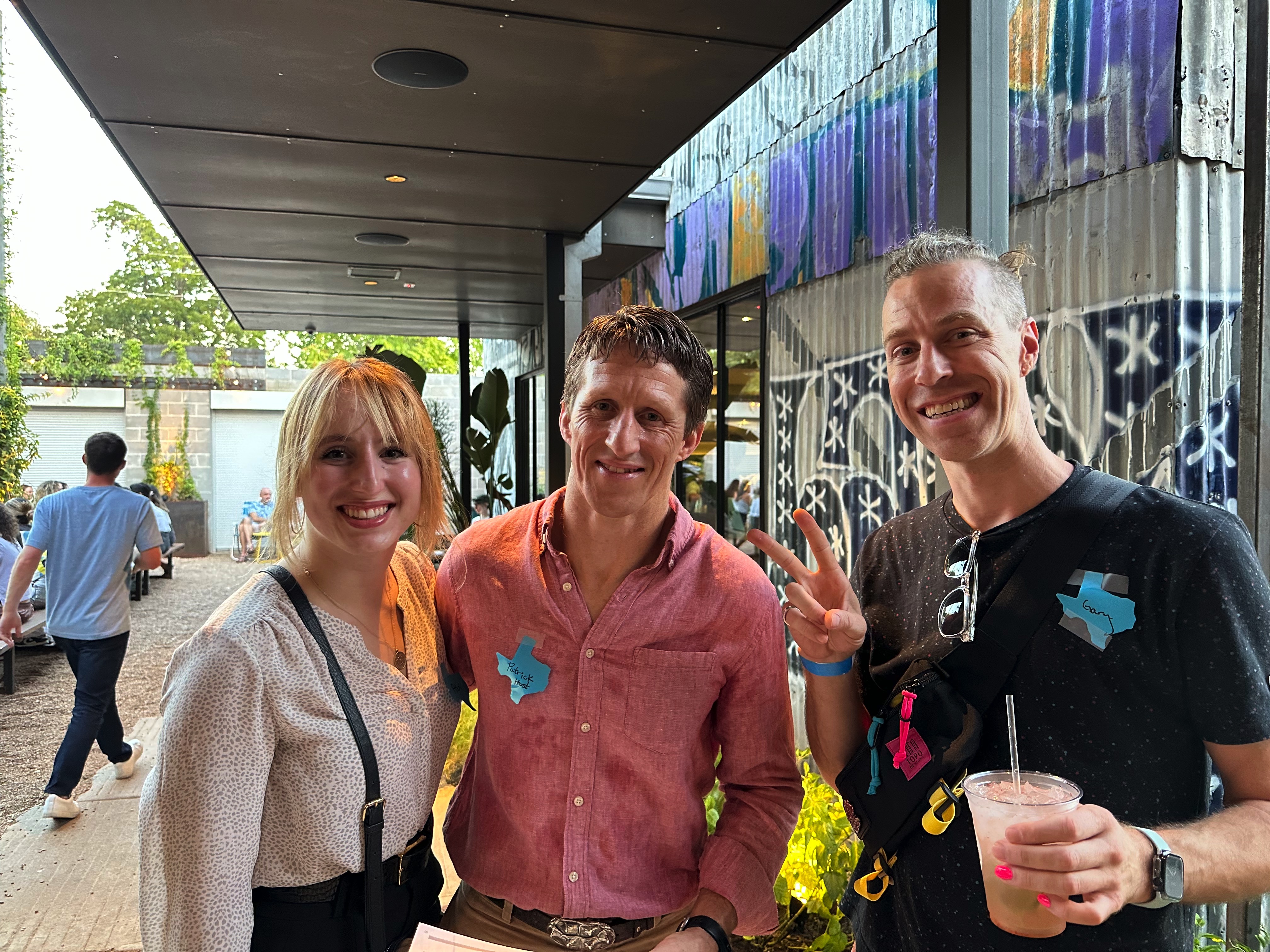 Hosts Patrick and Abigail with longtime Shopify Meetup member Gary